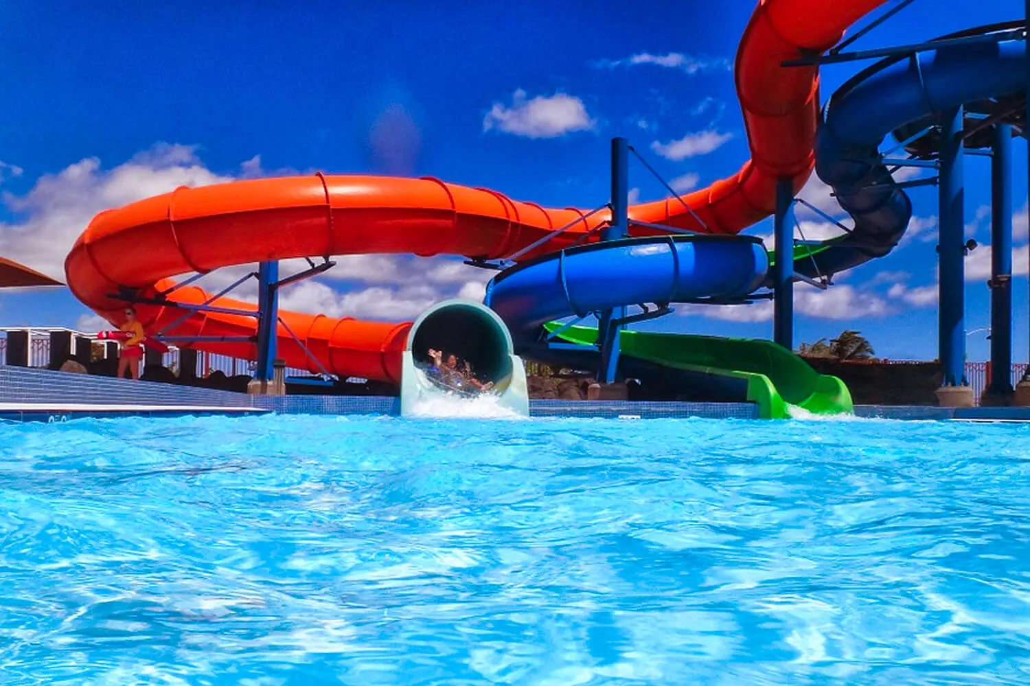 person exiting waterslide at the waterpark